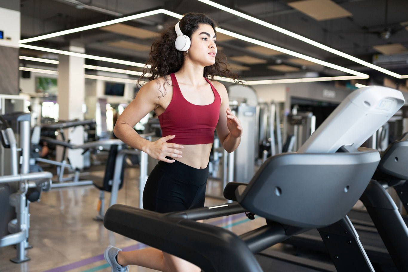 Woman Running on Treadmill | Blog | Greystar